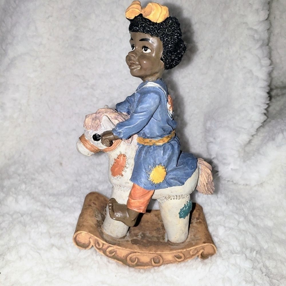 Vintage African American Girl on a Rocking Horse